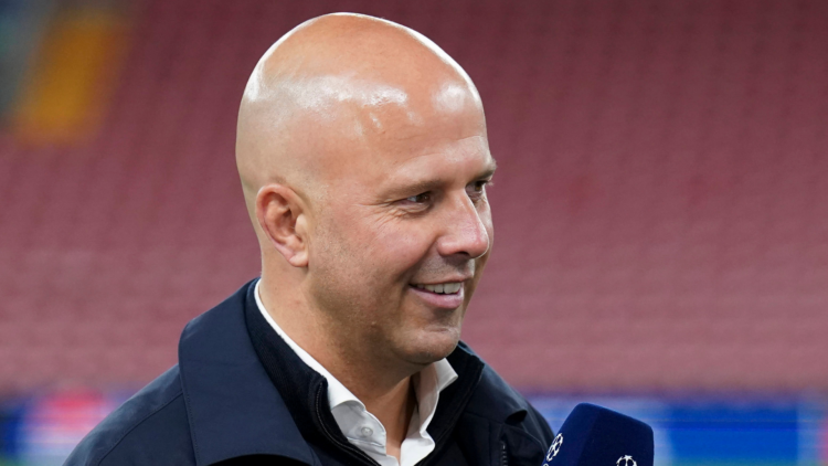 Liverpool manager Arne Slot smiles while being interviewed.