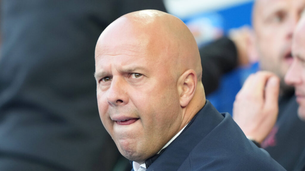Liverpool boss Arne Slot stares concernedly into the distance.