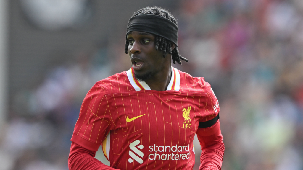 Jeremie Frimpong looking to the side whilst in action for Liverpool.
