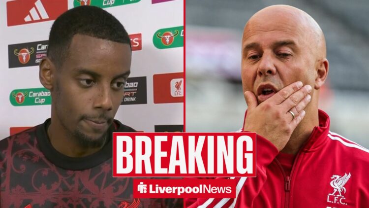 Liverpool manager Arne Slot looking annoyed with Alexander Isak being interviewed by Sky Sports to the left.