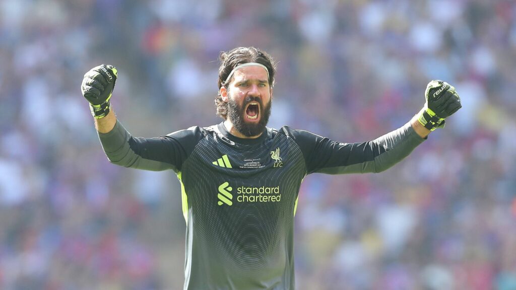 Liverpool star Alisson looking happy.